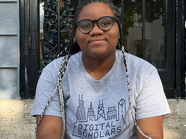 Black female student in Digital Scholars T-shirt