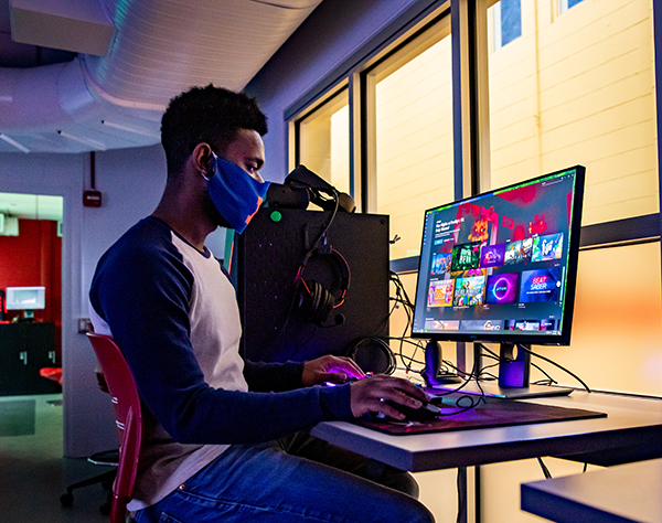 student working on colorful computer
