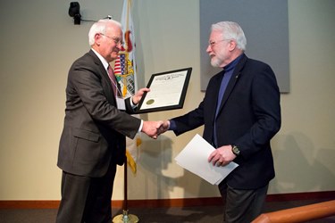 President Robert Easter gives proclamation to NCSA Director Tom Dunning.